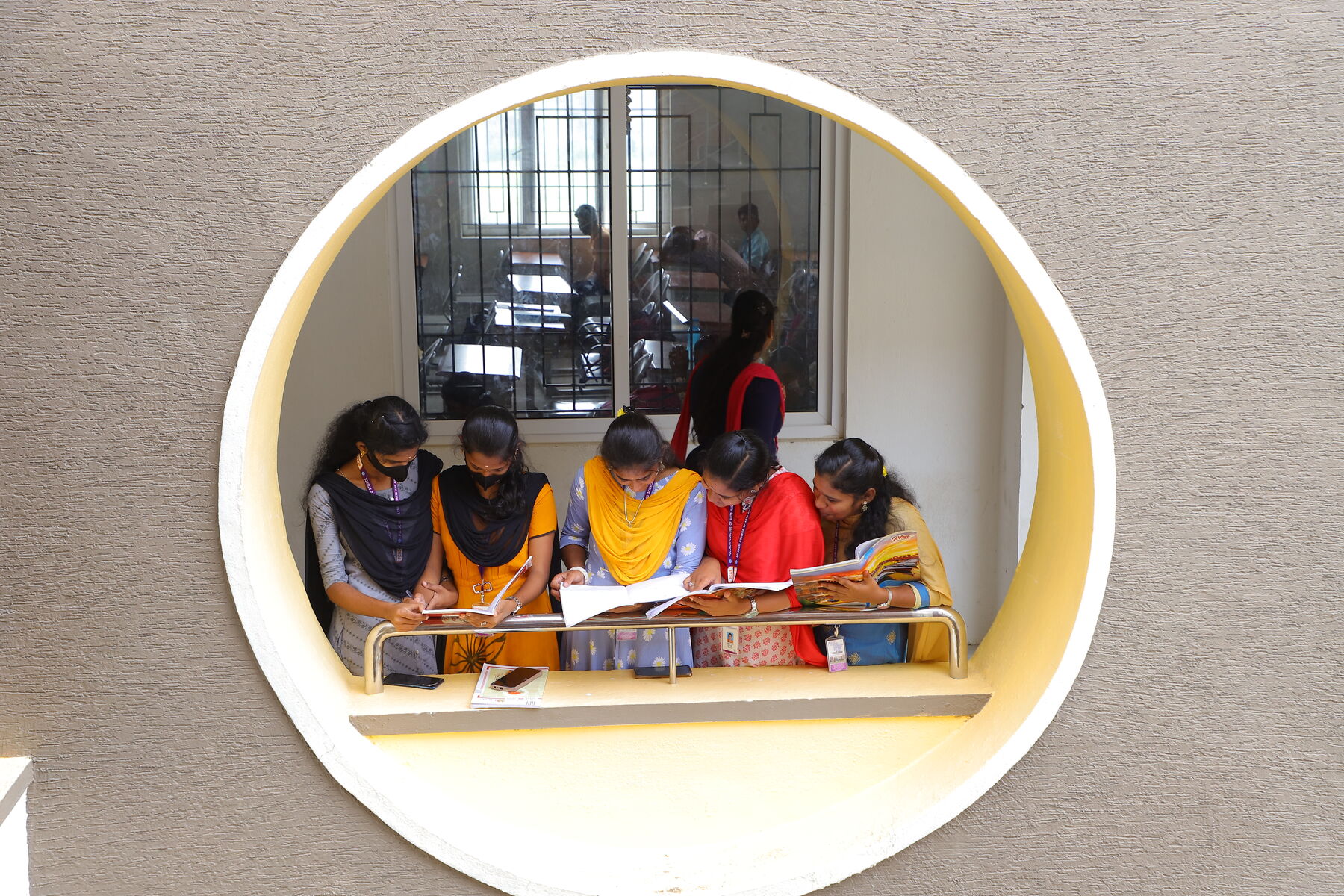 Students reading at the campus window